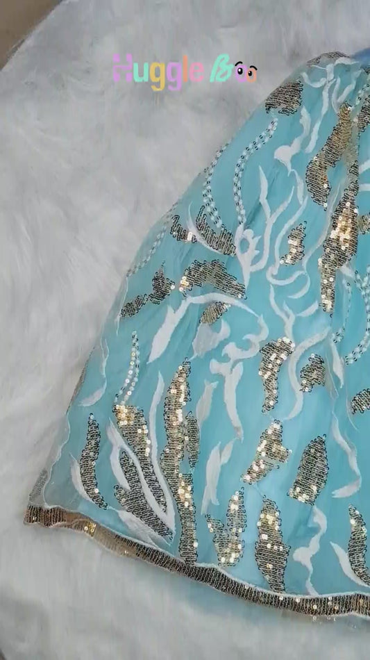 Little girl dressed in a royal blue kids’ lehenga from HuggleBoo — soft, twirl-friendly, and designed with non-itchy fabric and gentle waistbands. Perfect festive outfit for weddings, parties, and celebrations with effortless comfort.